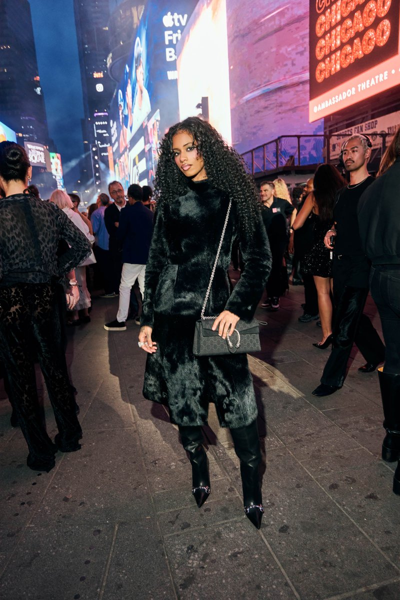 Guest in a Fur Coat at an Evening Event in Times Square