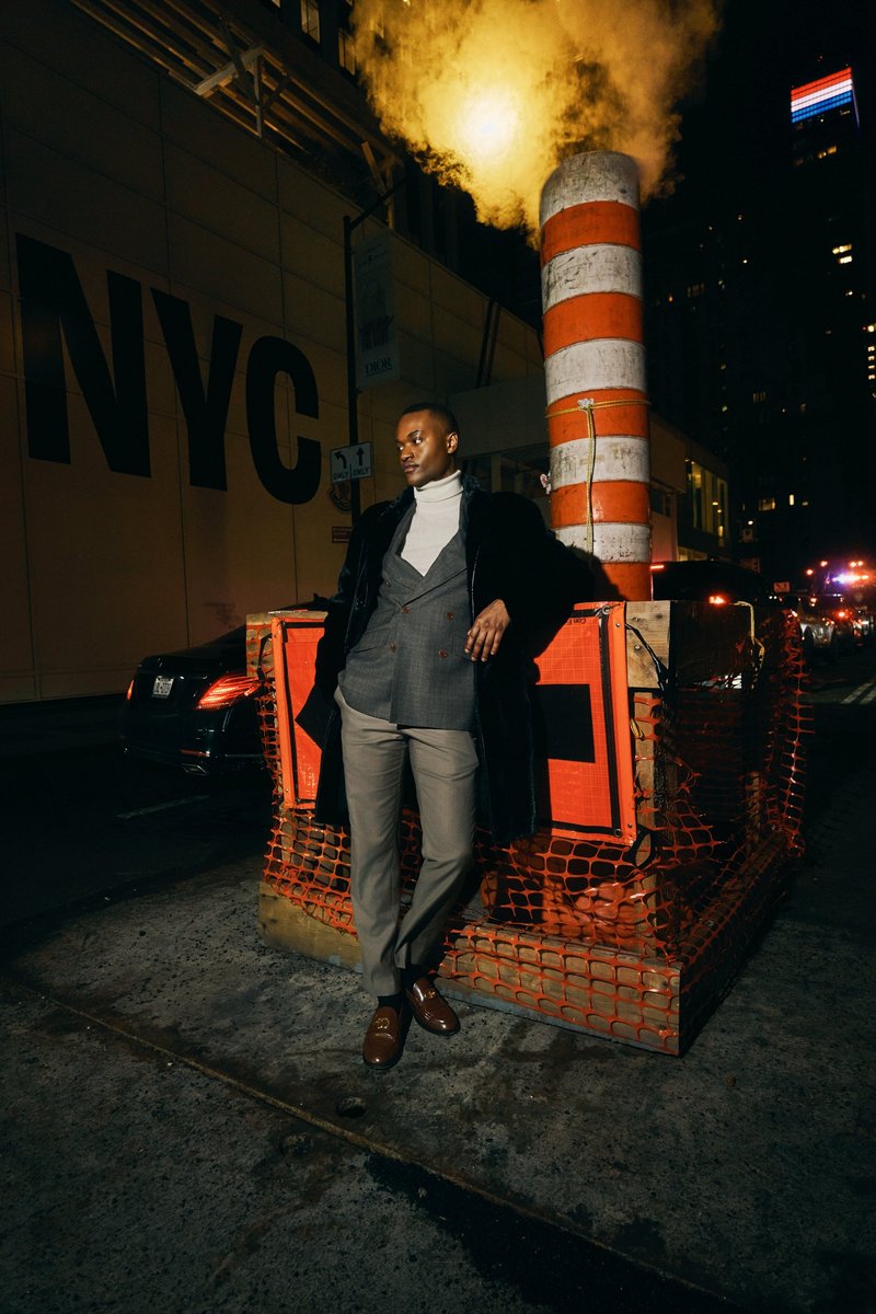 Man in a Suit by Steam on a Manhattan Street at Night