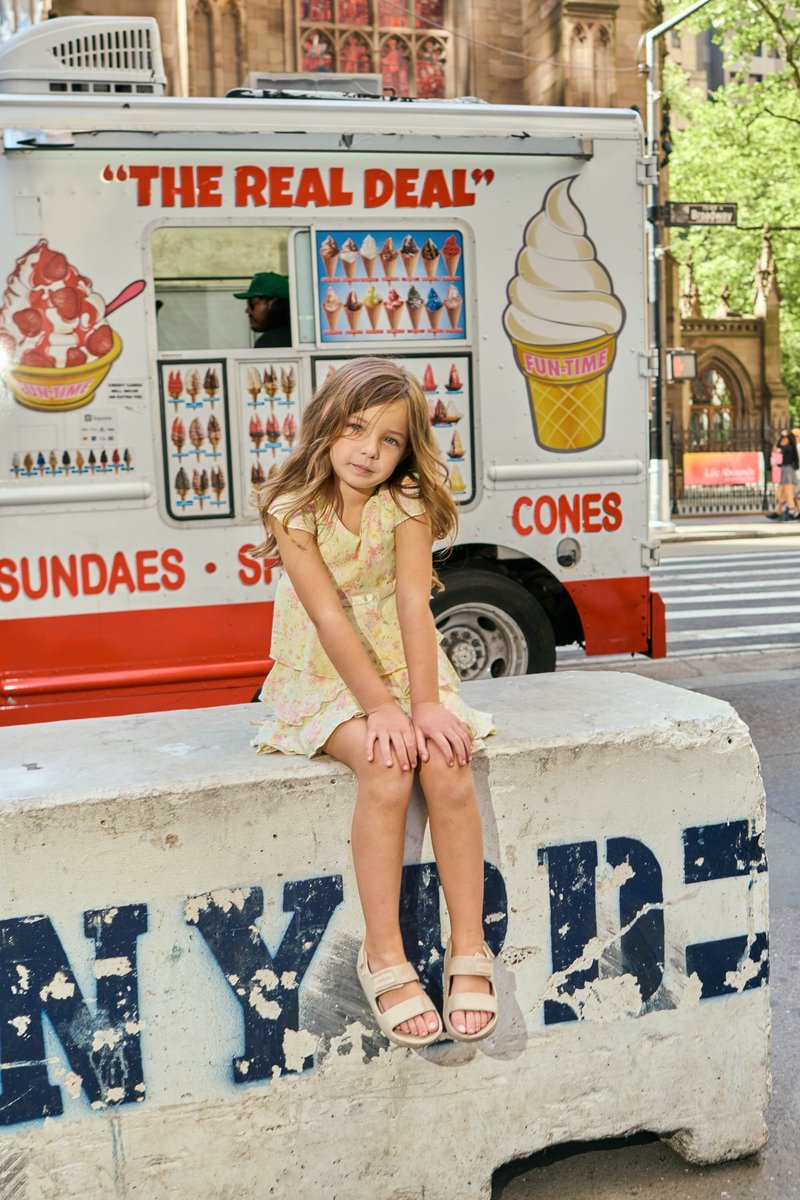 Girl by an Ice Cream Truck on a New York Street