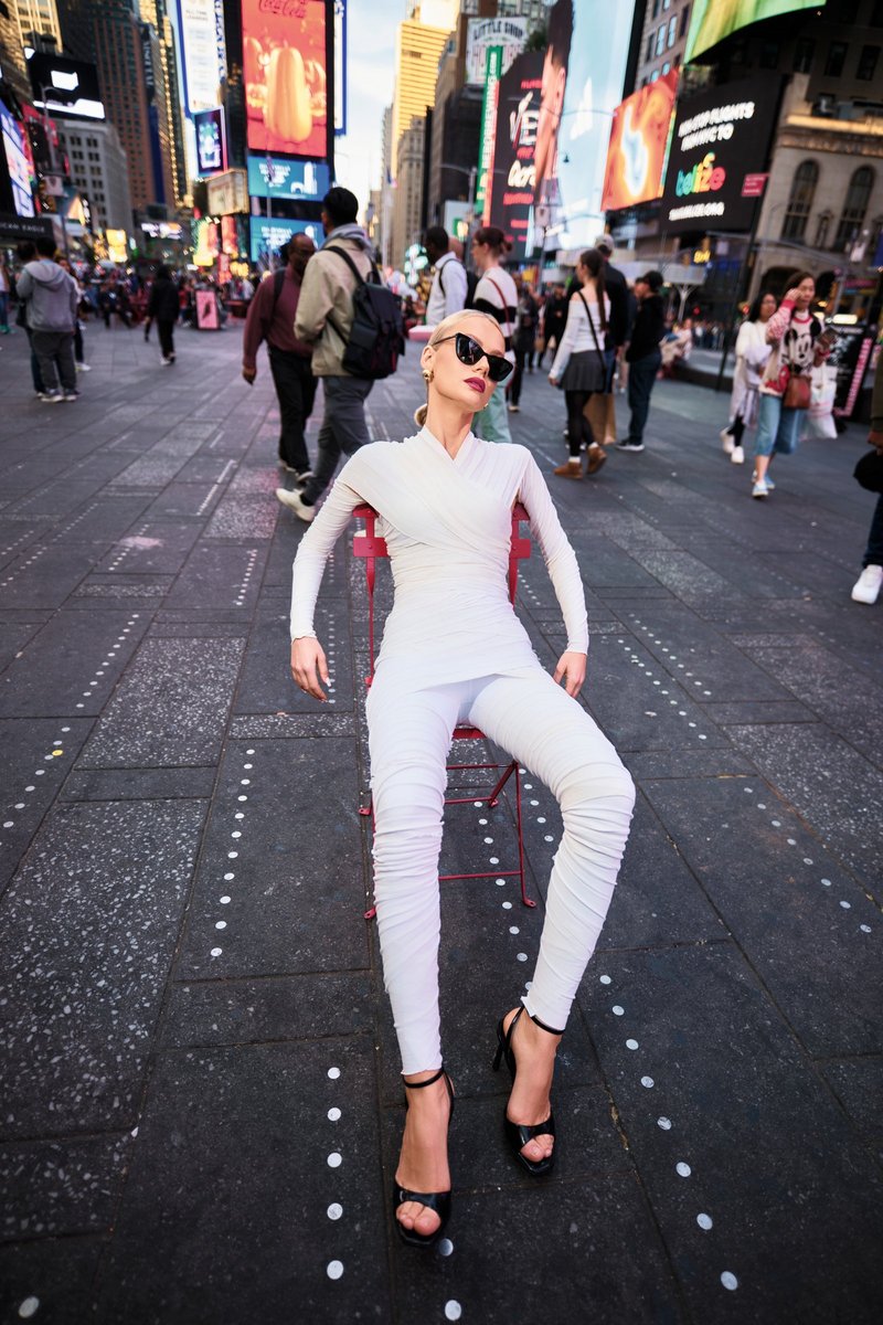 Model Seated on a Red Chair in Times Square