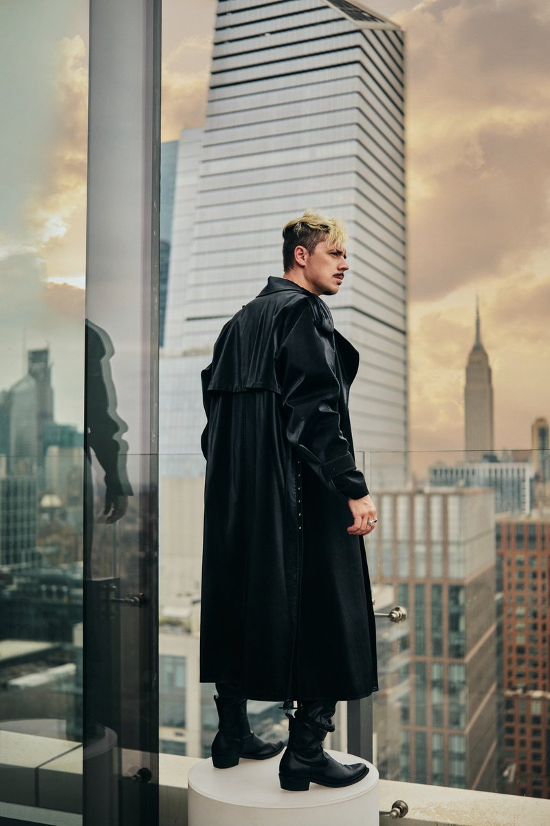 Model in a Leather Coat Above the Manhattan Skyline