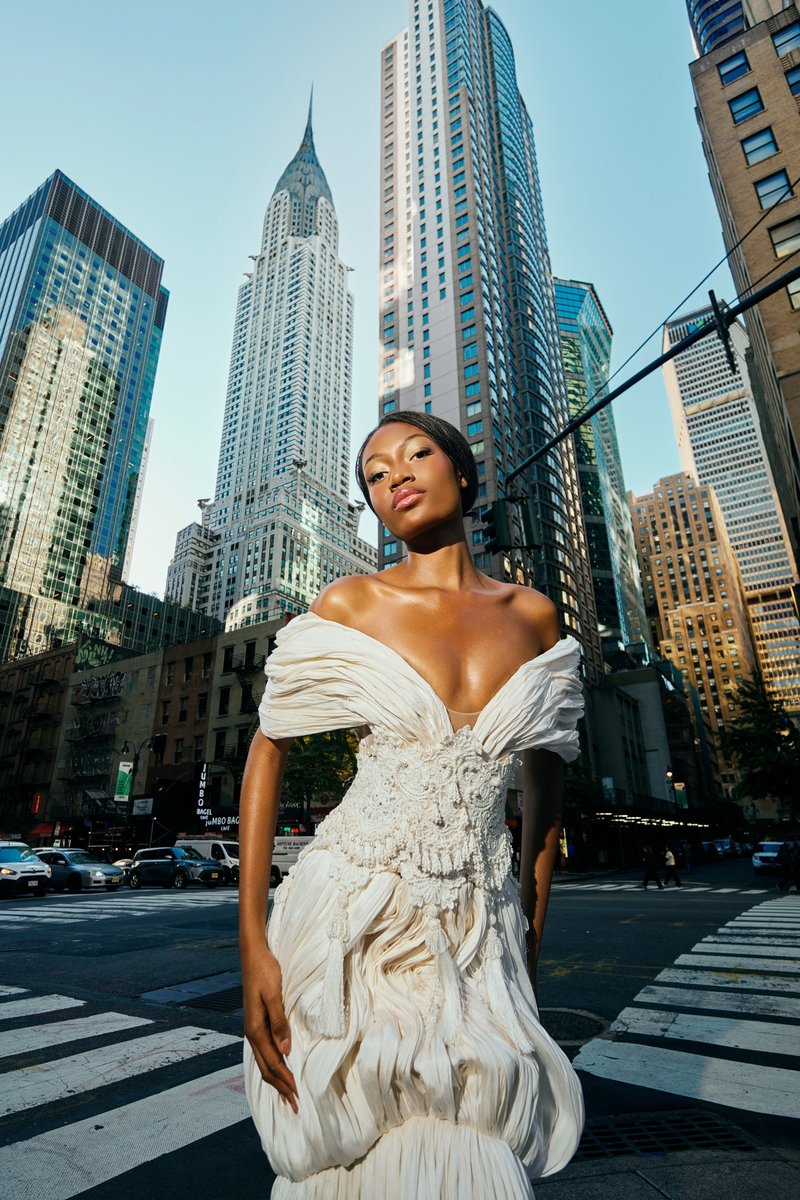 Model in White Below the Chrysler Building
