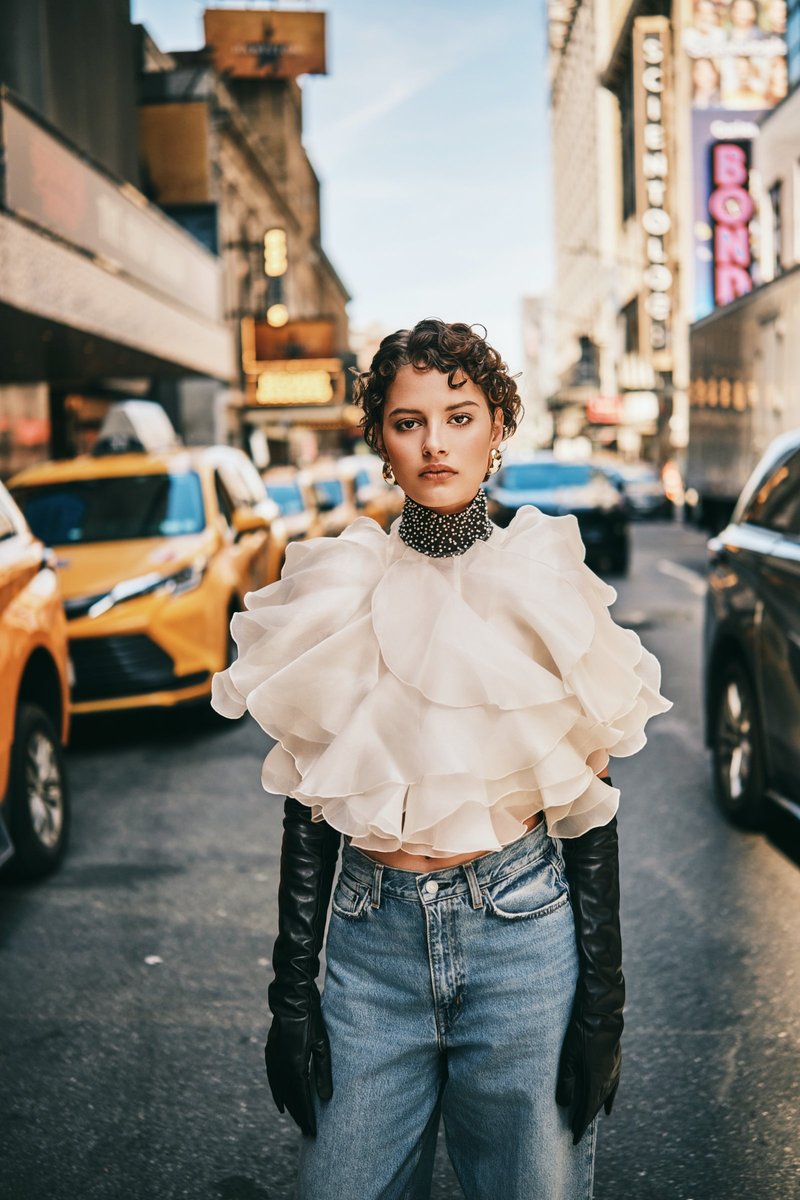 Model in a Ruffled Blouse on a Theater District Street