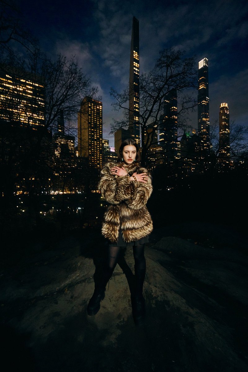Model in Fur with the Central Park Skyline at Night