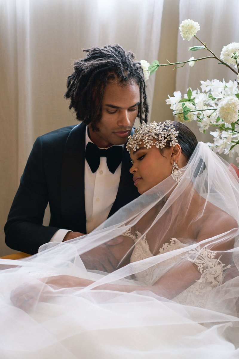 Groom and Bride Under a Crystal-Adorned Veil