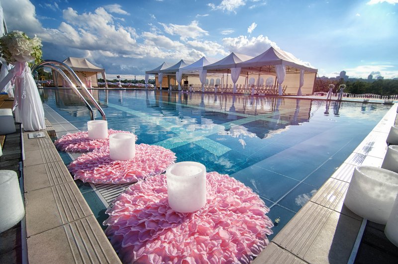 Poolside Wedding Decor with Floral Arrangements