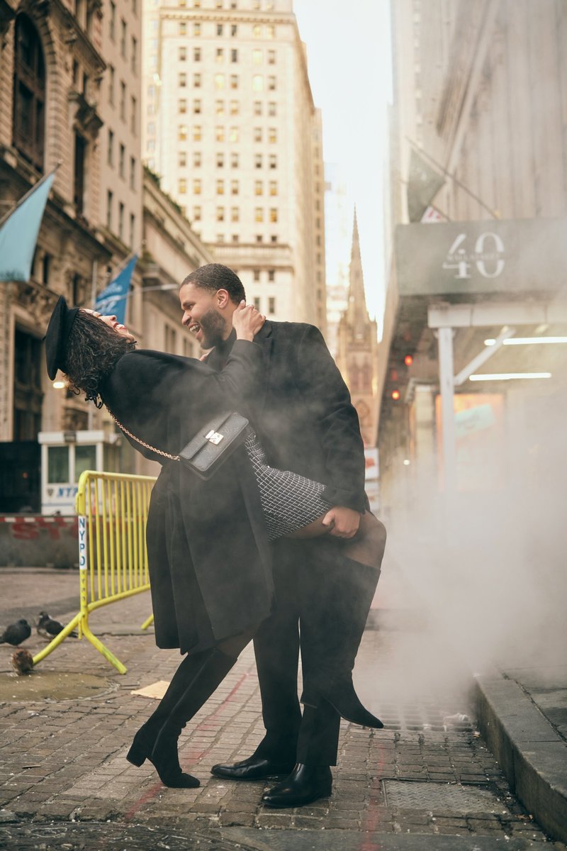 Couple by Steam on a Financial District Street