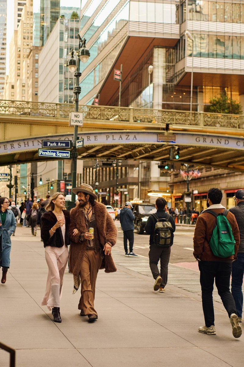Couple Walking by Pershing Square at Grand Central