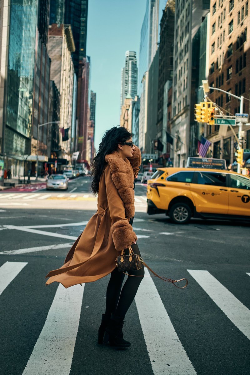Woman in a Camel Coat Crossing a Manhattan Avenue