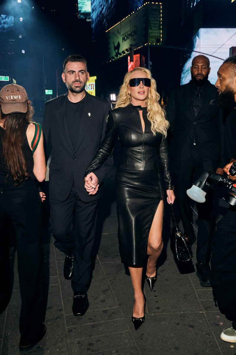 Couple Arriving at an Evening Event in Times Square