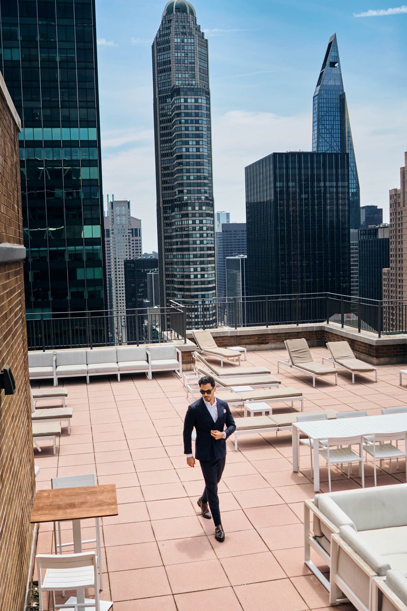 Man in a Navy Suit on a Manhattan Rooftop Terrace