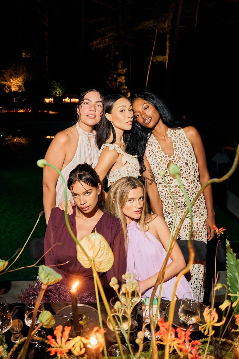 Friends at an Outdoor Evening Party with Candlelight