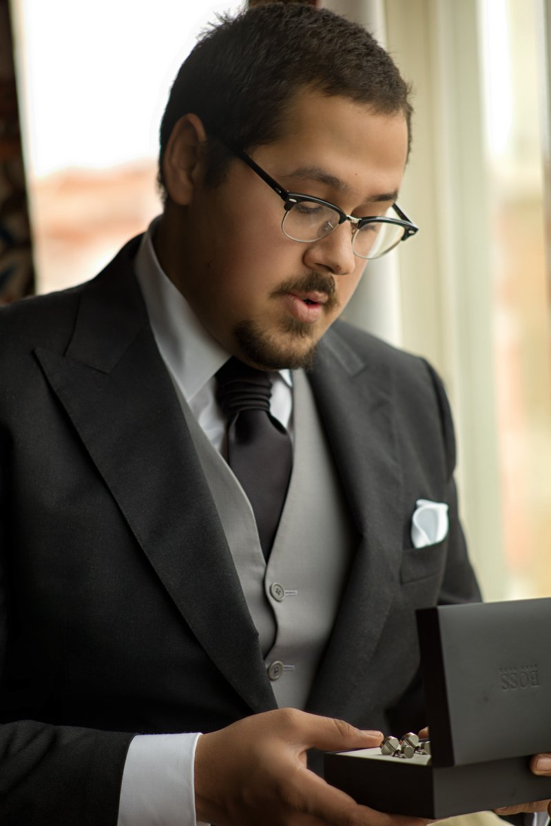 Groom Opening a Gift Box on the Wedding Morning